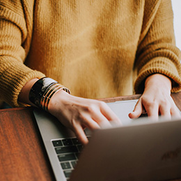 Image of someone using their computer.