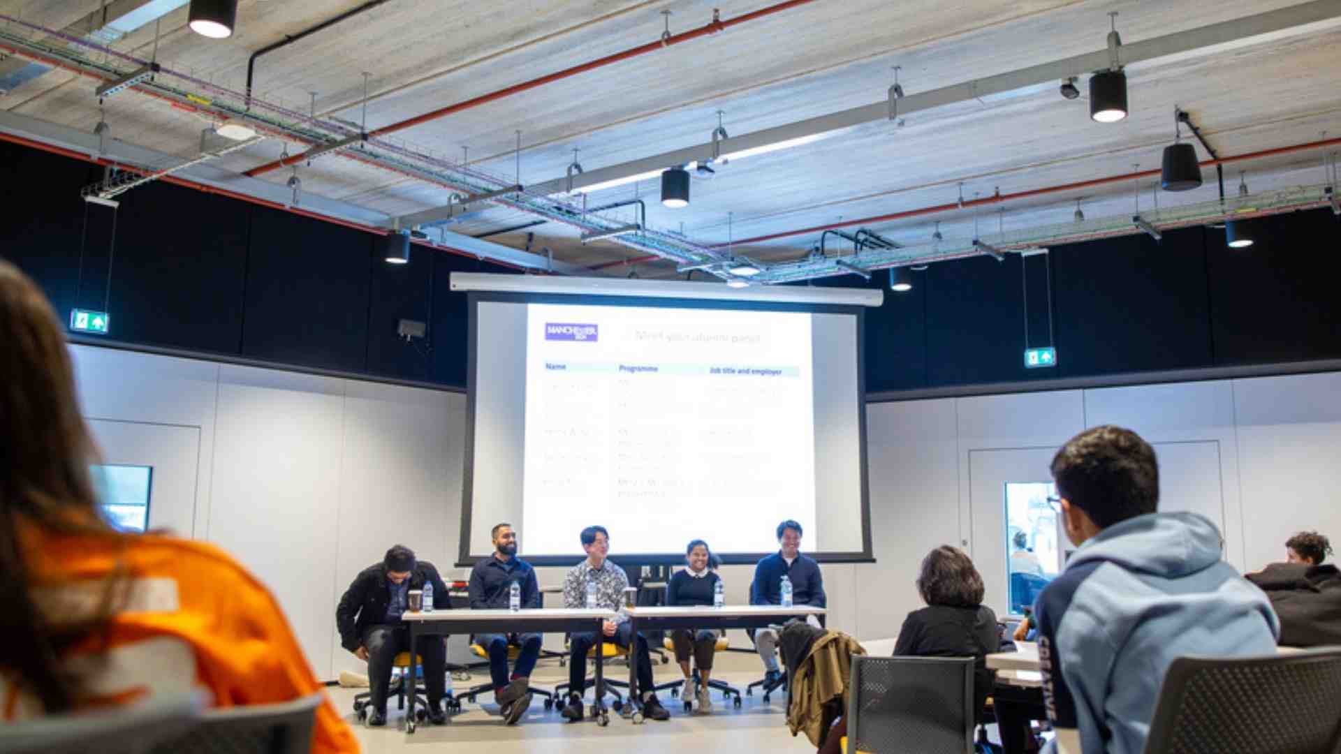 An alumni panel session in the Nancy Rothwell building.