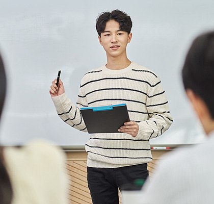 Student completing a presentation in class.