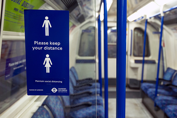 London tube with sign "Please keep your distance"